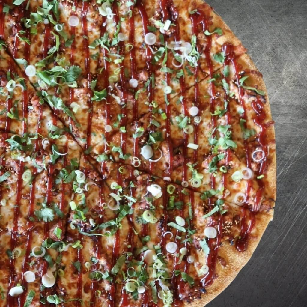 Smoked pork marinated in our spicy gochujang BBQ sauce, layered with mozzarella and roasted sesame seeds. Finished with our flavorful gochujang BBQ drizzle, fresh cilantro, and crisp scallions. Korean-inspired flavors with a little Gangnam style in every bite. Created exclusively for Sgt. Pepperoni's by Chef Daniel Hohng.